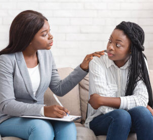woman talking to female therapist